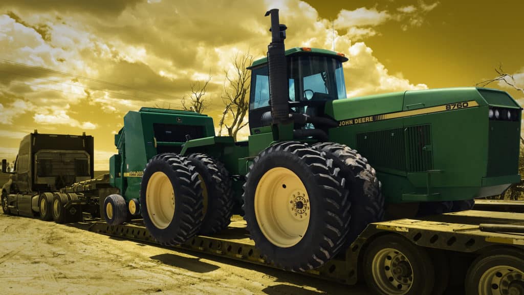 John Deere 8760 Tractor loaded for transport
