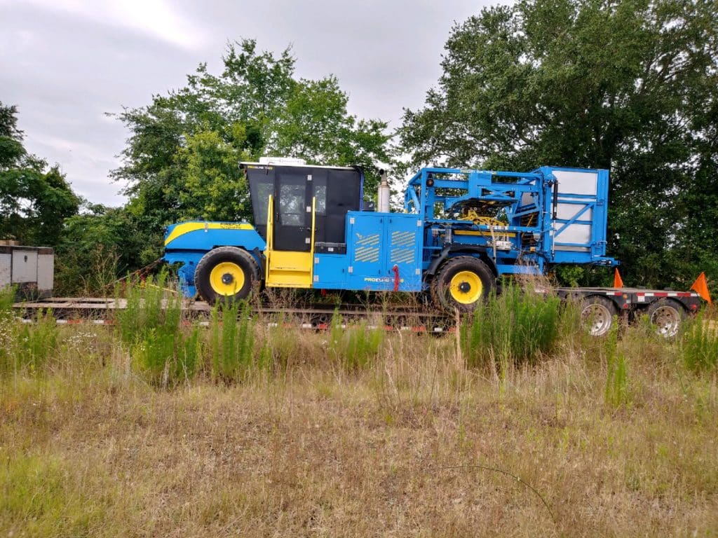 Shipping a harvester on a lowboy trailer