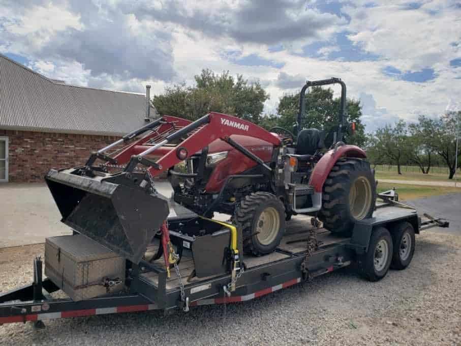 Yanmar YT359 Tractor and boxspreader loaded for transport