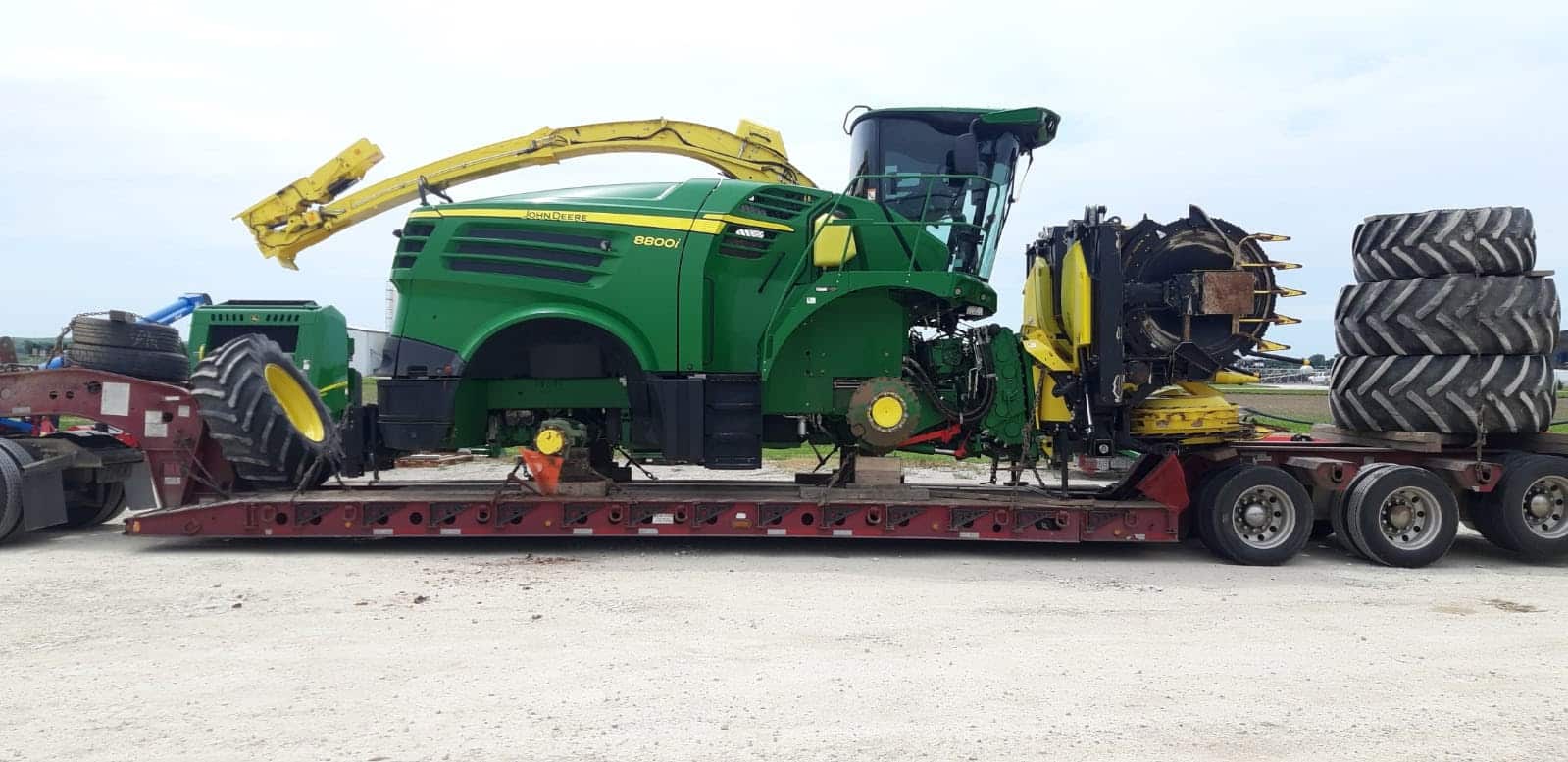 Shipping a John Deere SPFH 8800 Harvester and header on a lowboy trailer