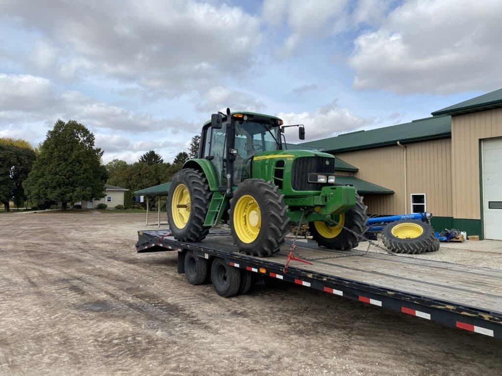 John Deere 7230 tractor loaded for transport