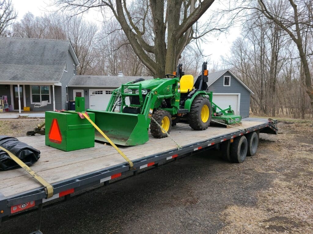 John Deere tractor loaded for transport