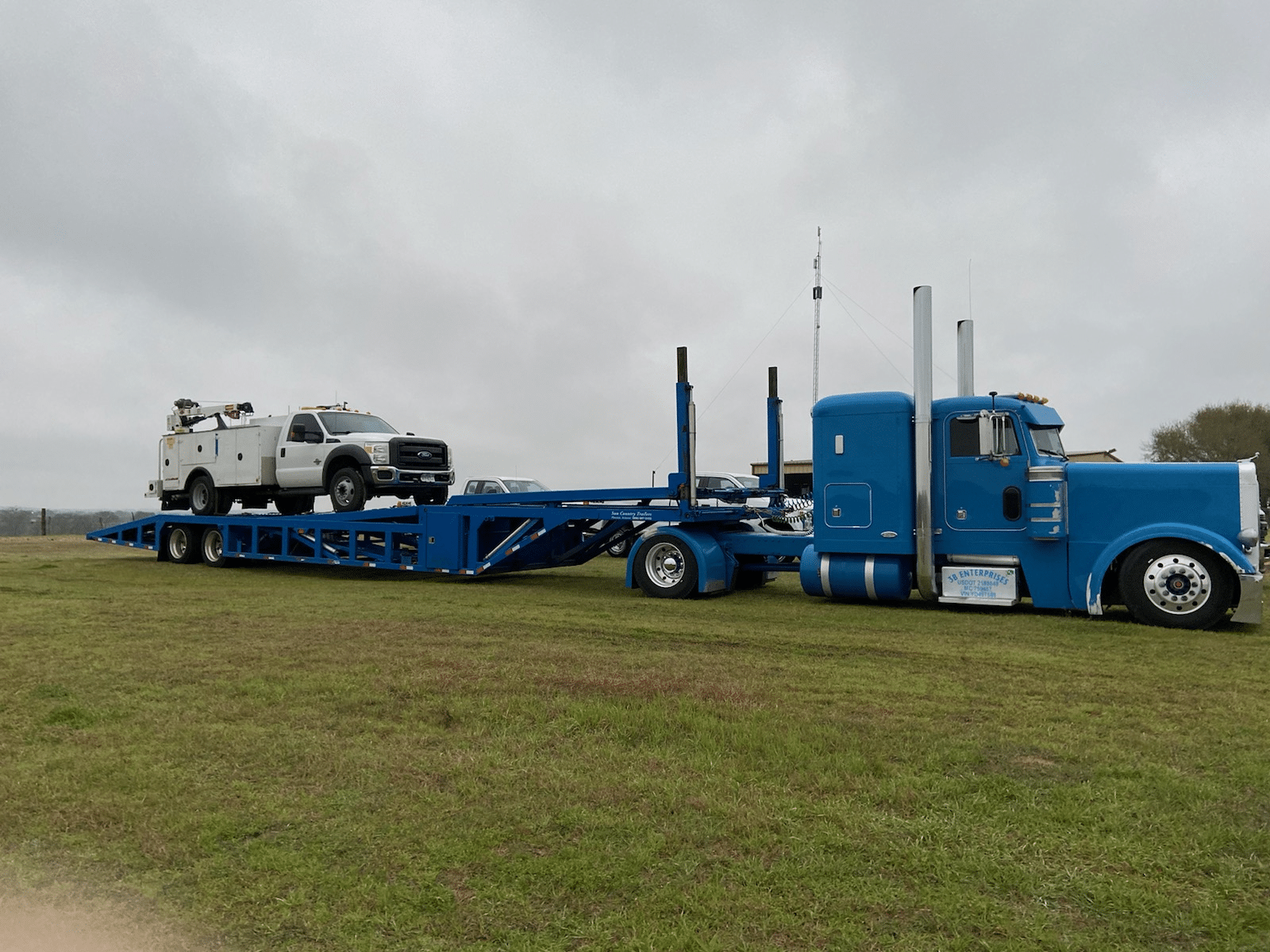 2014 Ford F-550 Truck transported on an auto carrier trailer