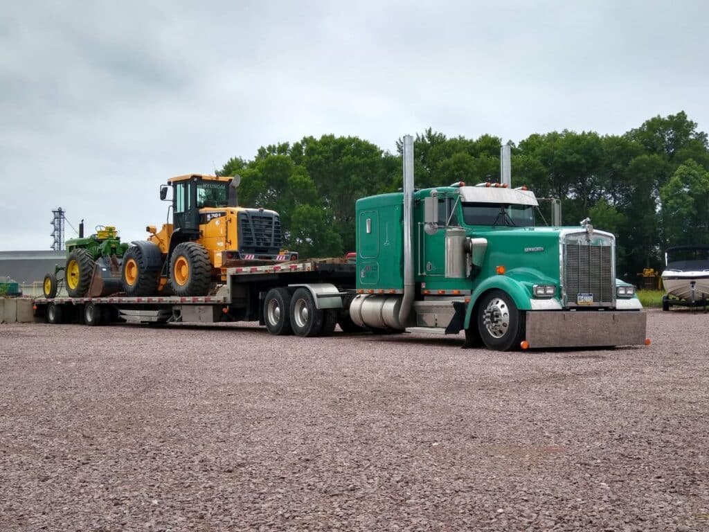 Hyundai HL740-9 Wheel Loader and John Deere Tractor loaded for transport