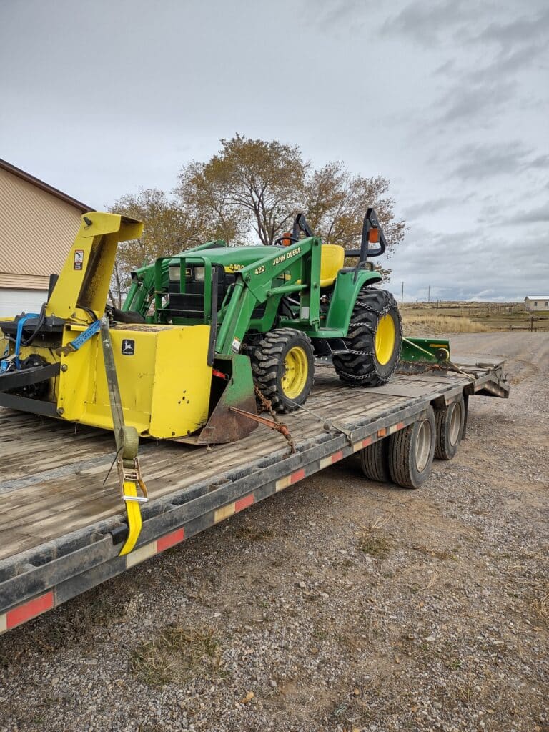 Shipping a John Deere 420 Tractor loaded for transport
