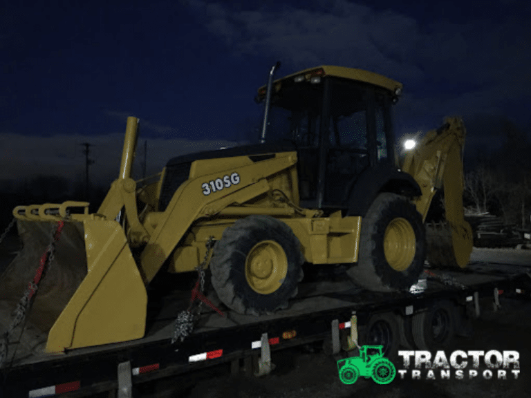 Hauling a 2005 John Deere 310sg.