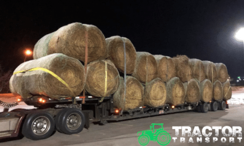 Bales of hay loaded on a step deck trailer for shipping