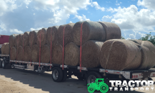 Bales of hay loaded on a step deck trailer for transport
