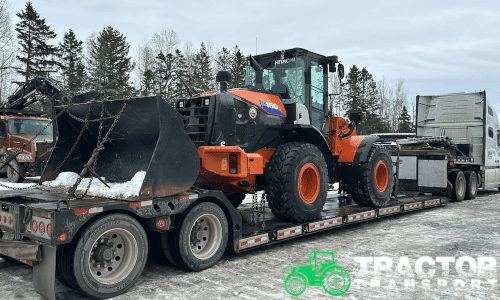 Hitachi ZW150-6 Wheel Loader loaded for transport on a lowboy trailer