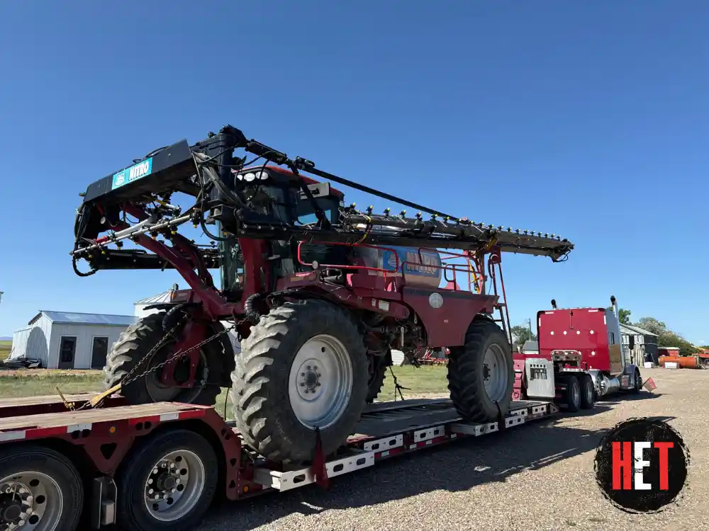 Case IH agricultural sprayer loaded for farm equipment transport in Compton, CA