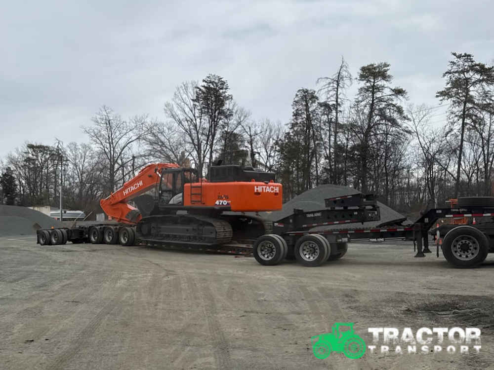 Hitachi ZX470LC-6 excavator being transported on a specialized trailer for heavy equipment shipping services in Thornton, CO