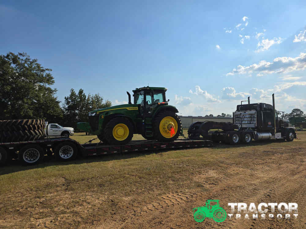 Transporting a John Deere 8R 280 agricultural tractor with dual tires in Chicago, IL