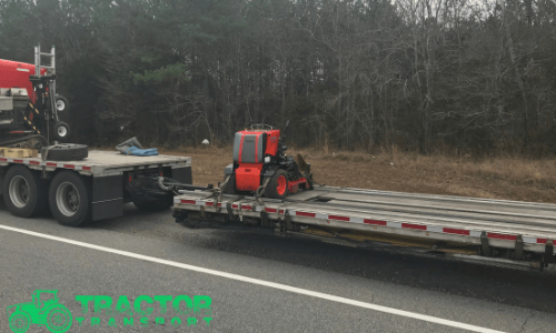 Tractor Transport hauls farm mowers