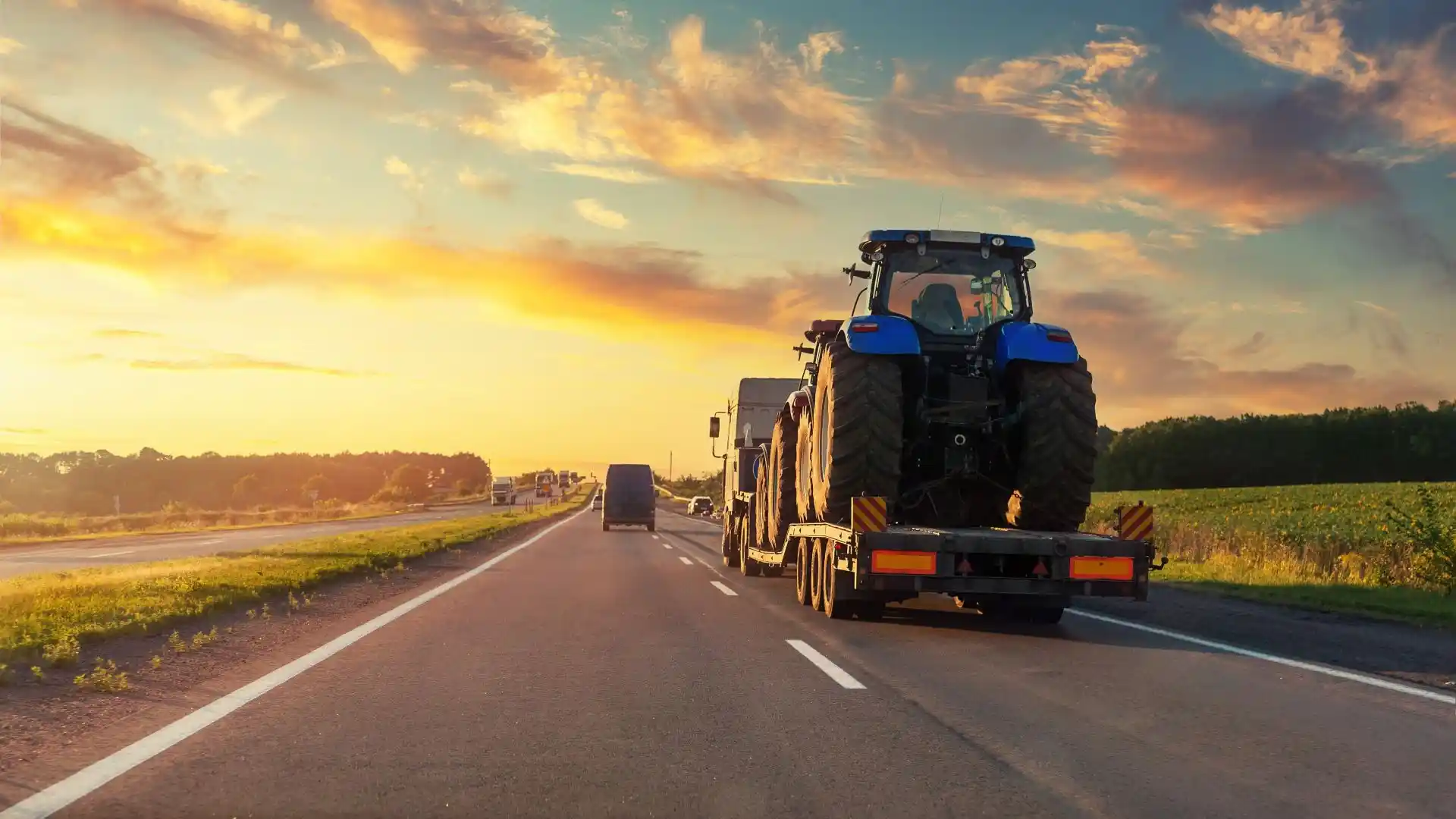 Tractor being hauled into the sunset